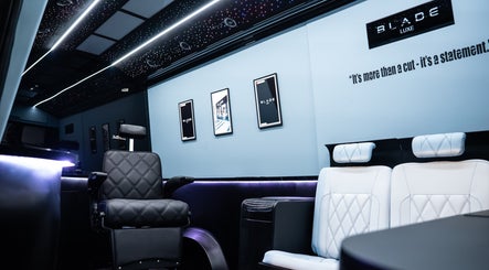 Elegant interior of Blade Luxe, a premium barbershop in Abu Dhabi, UAE, showcasing luxury seating and decor.