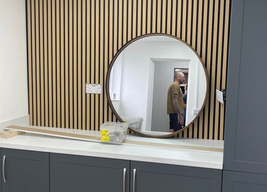 Sleek mirror on modern cabinet at Elegancewithellie, Walton, England, GB, enhancing sophisticated decor.