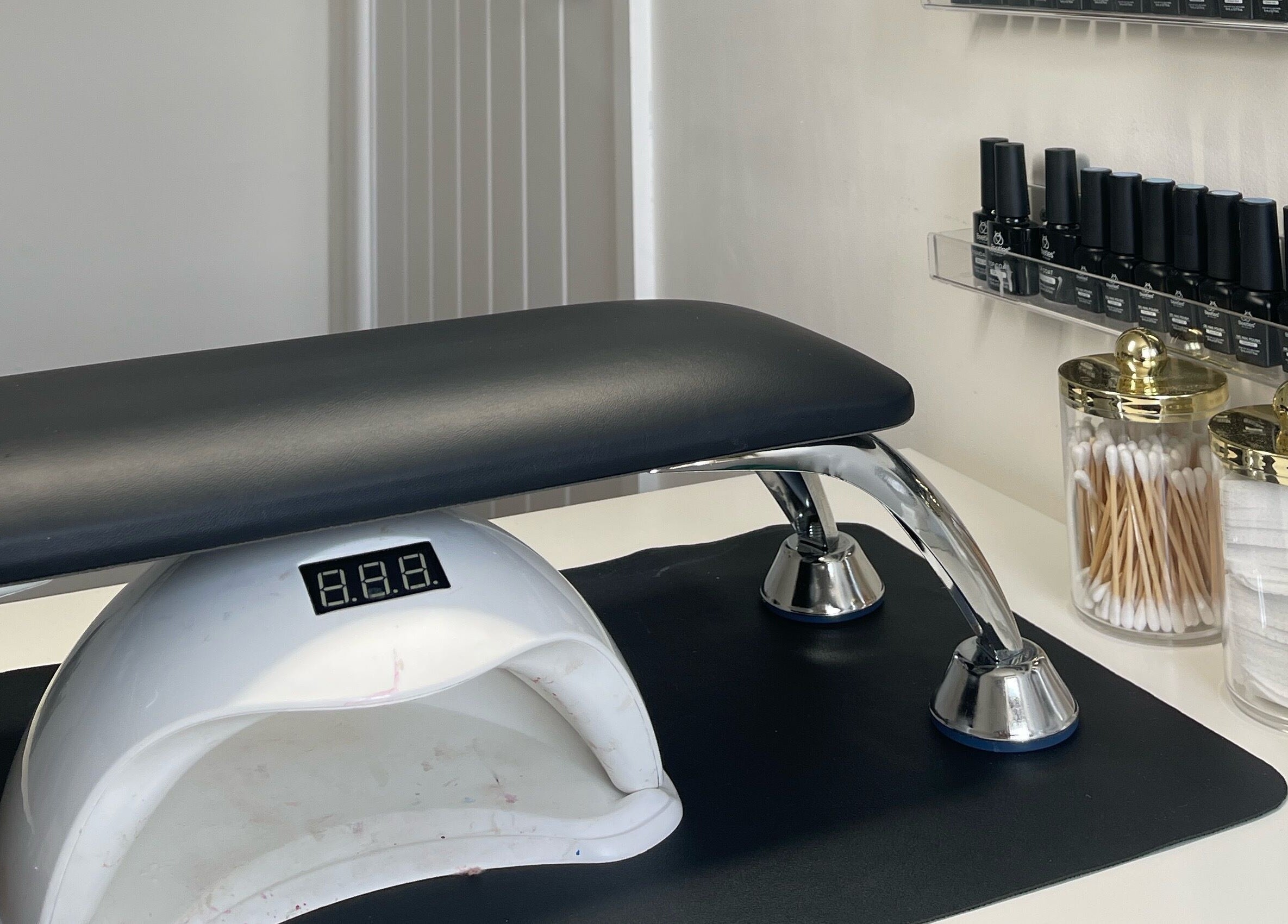 Professional nail station at Elegancewithellie, Walton, England, GB with sleek tools and organized supplies.