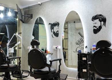 Contemporary grooming chairs at Perfect Image Gents Salon, Sharjah, Sharjah, AE, showcasing sleek design.