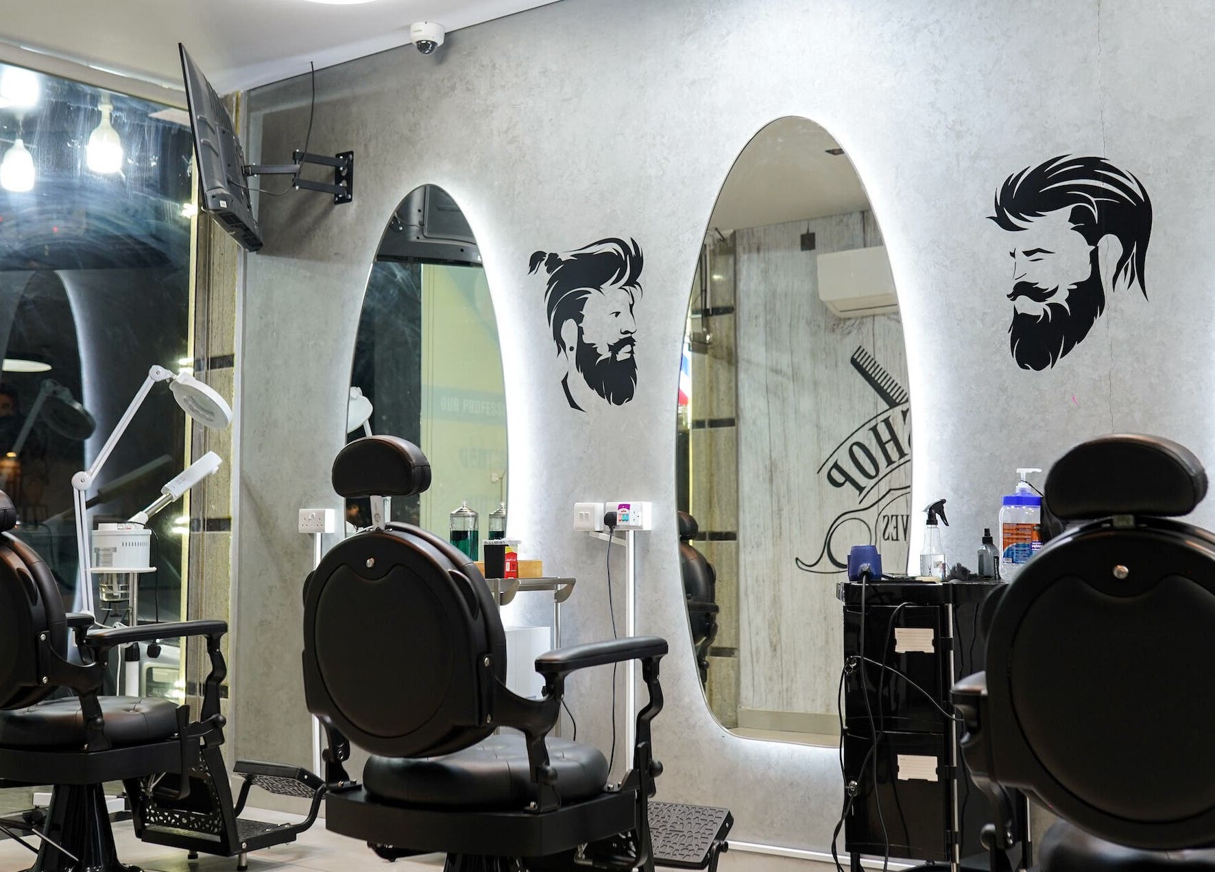 Stylish interior of Perfect Image Gents Salon in Sharjah, AE, featuring modern barber chairs and mirrors.