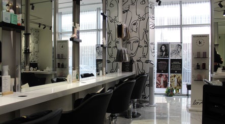 Modern salon interior at Hair Signature Beauty Lounge, Dubai, AE. Elegant design with stylish hair products displayed.