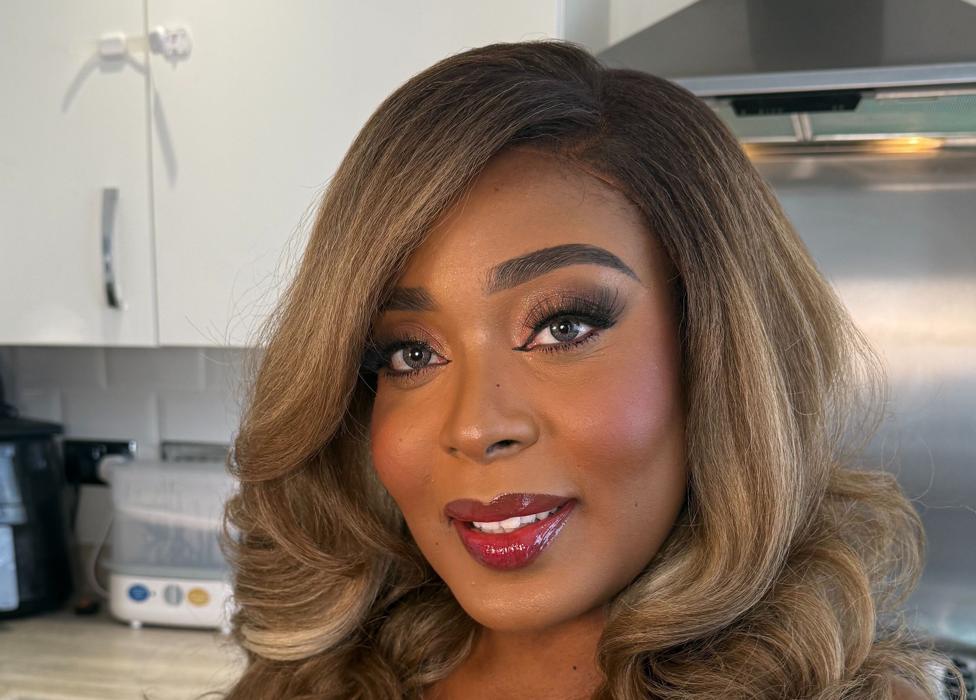 Close-up of a woman with radiant makeup at Mubapro, Manchester, England, GB.