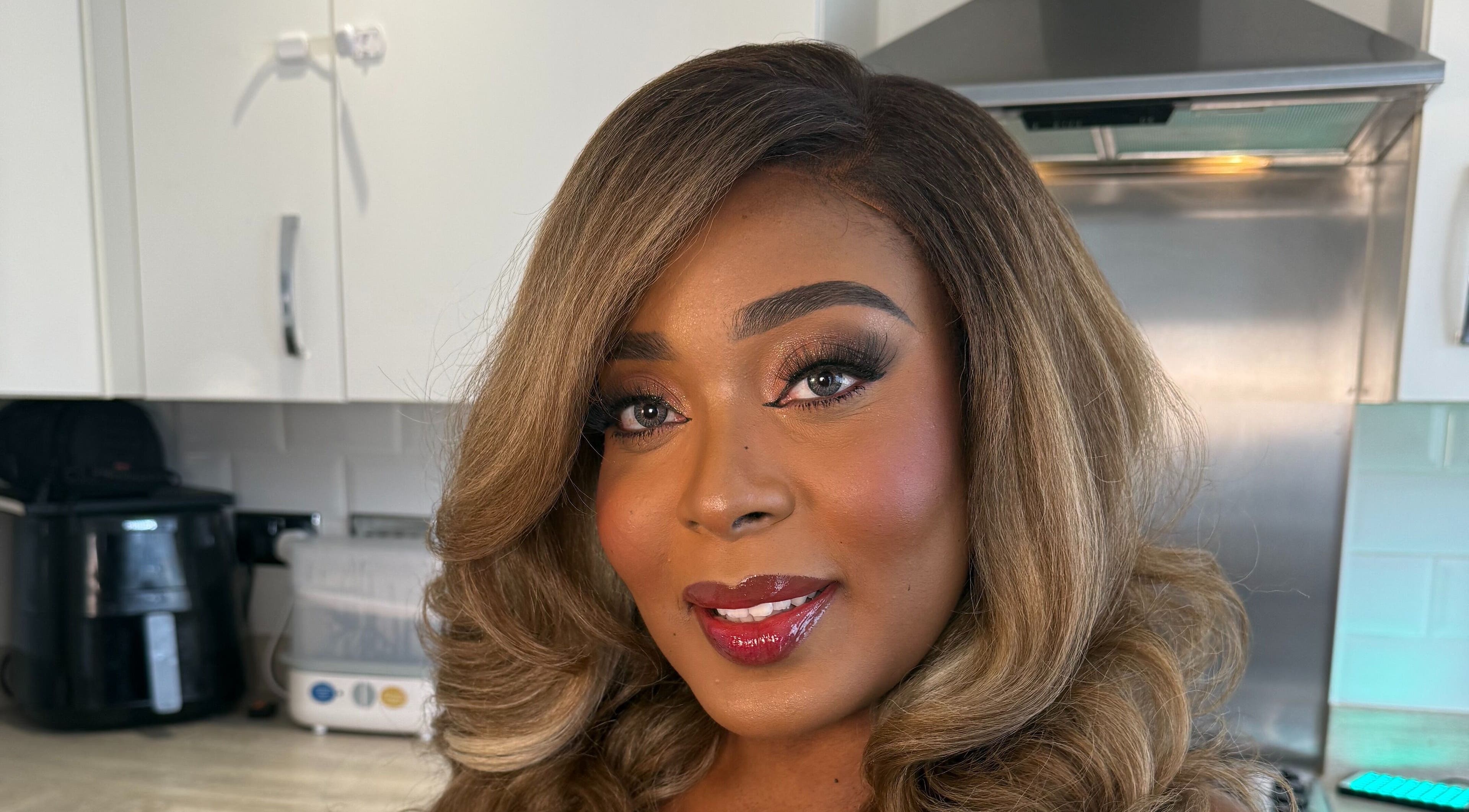 Close-up of a woman with radiant makeup at Mubapro, Manchester, England, GB.