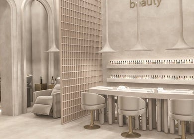 Chic nail salon interior at Holly's Nails, Vancouver, British Columbia, CA with modern decor and polish display.