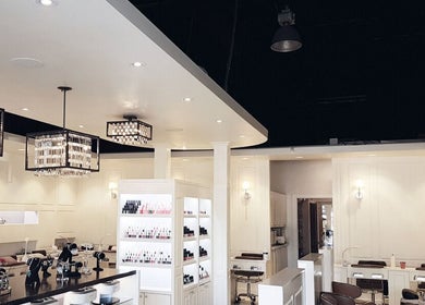 Luxurious salon interior at Holly's Nails, Vancouver, British Columbia, CA with elegant lighting and nail polish displays.