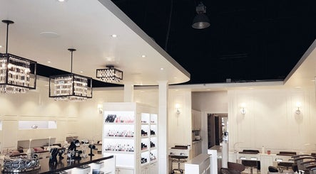 Luxurious salon interior at Holly's Nails, Vancouver, British Columbia, CA with elegant lighting and nail polish displays.