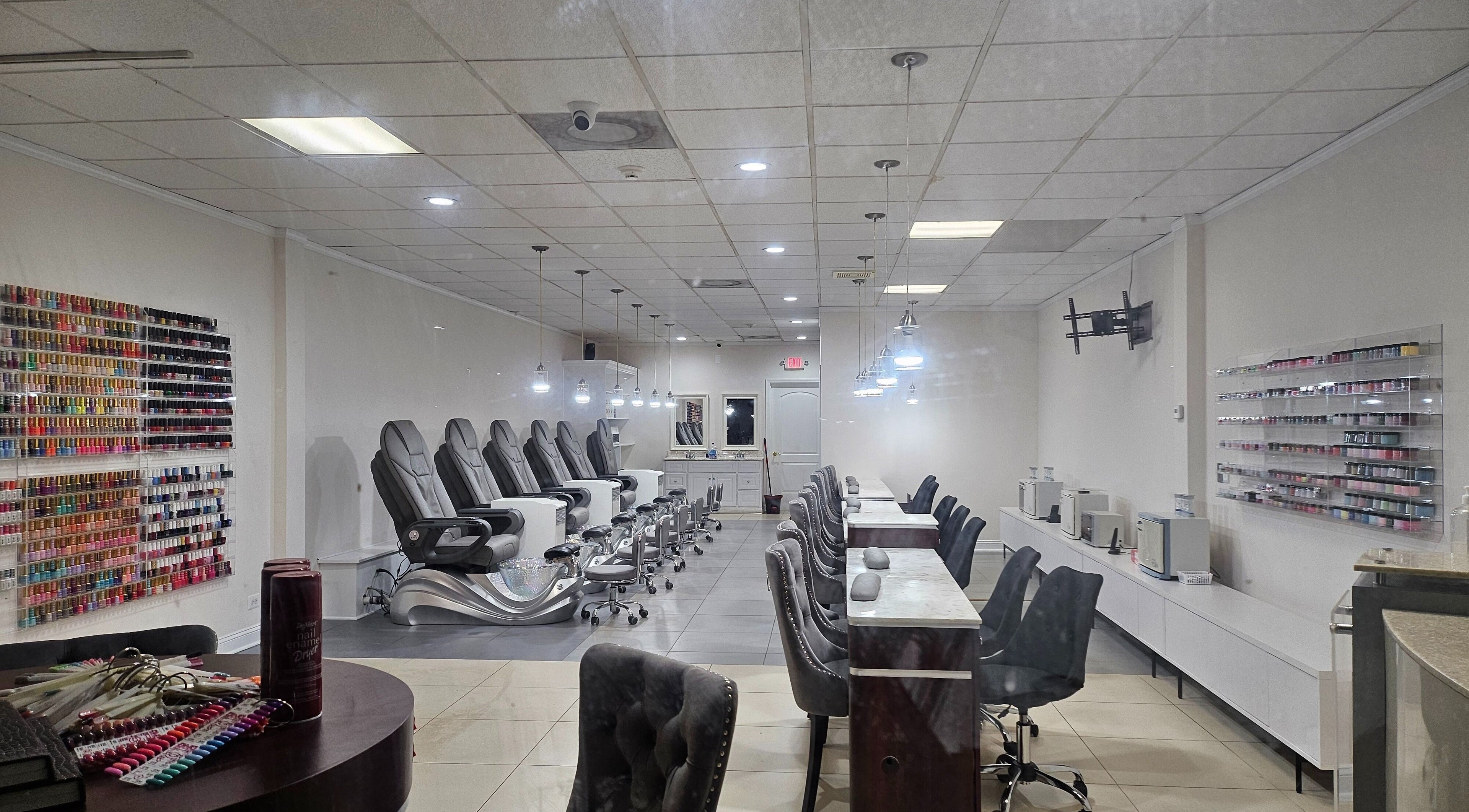 Sleek interior of DIF Nails in Schaumburg, Illinois, US featuring modern nail stations and polish display.