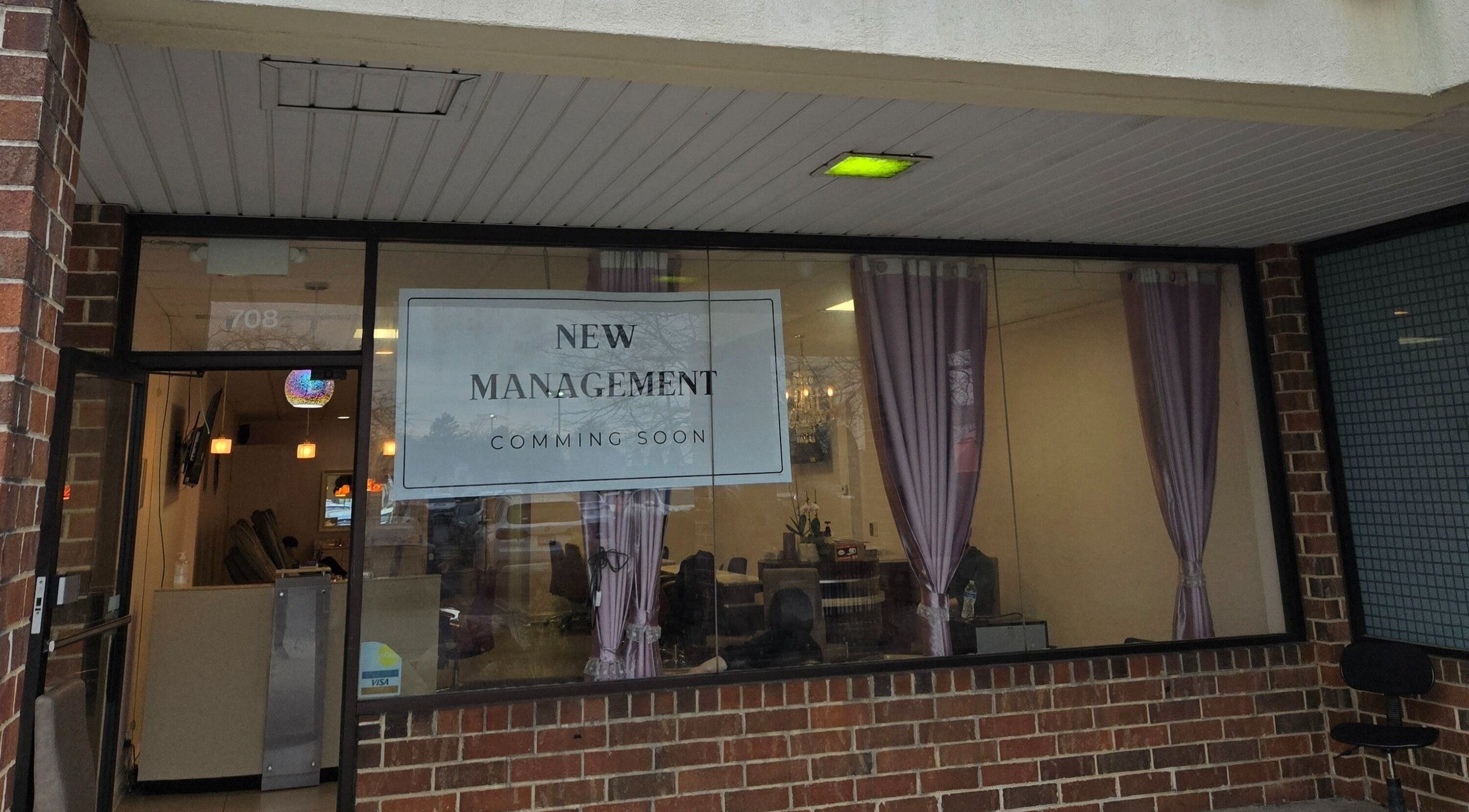 Exterior of DIF Nails in Schaumburg, Illinois, US under new management with purple curtains visible.