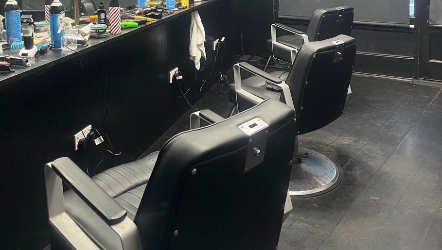 Barber chairs at RUDEBOYS, Portlaoise, County Laois, IE, showcasing a sleek and modern interior.
