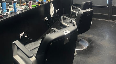Barber chairs at RUDEBOYS, Portlaoise, County Laois, IE, showcasing a sleek and modern interior.