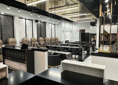 Chic interior of Luxe Nail Studio in Madison, Wisconsin, US showcasing stylish nail stations and luxurious decor.