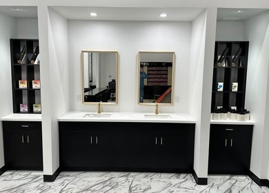 Elegant vanity area with mirrors and sleek counters at Luxe Nail Studio in Madison, Wisconsin, US.