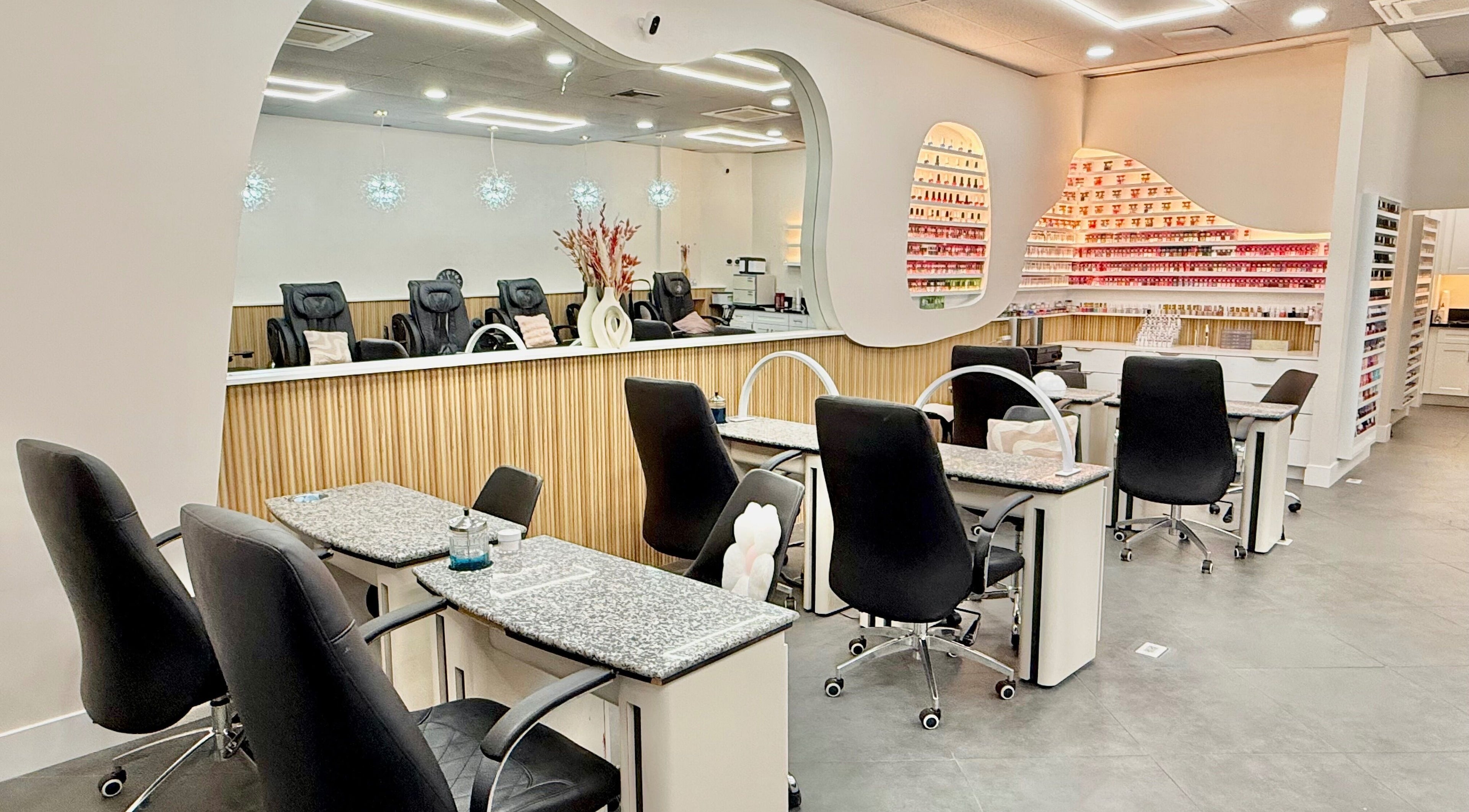 Modern interior of Nail Society in Los Angeles, California, US with elegant nail stations and decor.