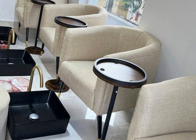Relaxing pedicure chairs at Alora Nail Studio, Lagos, Lagos, NG, featuring plush seating and foot basins.