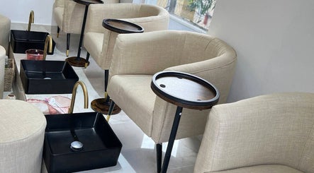 Relaxing pedicure chairs at Alora Nail Studio, Lagos, Lagos, NG, featuring plush seating and foot basins.