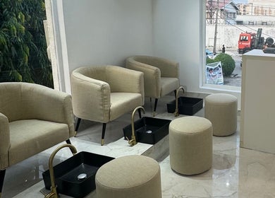 Cozy pedicure seating at Alora Nail Studio, Lagos, Lagos, NG, offering a tranquil wellness experience.