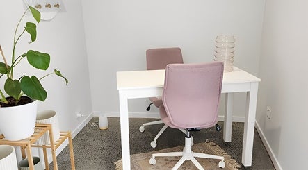 Modern office at Daisy Rose Beauty by Design, Bridgewater, Tasmania, AU, featuring chic pastel decor and greenery.