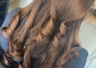 Elegant curls styled at SC Hair Design, Thirsk, England, GB emphasizing luxurious hair beauty.