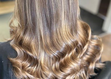 Golden hair waves styled at SC Hair Design in Thirsk, England, GB, showcasing professional salon quality.