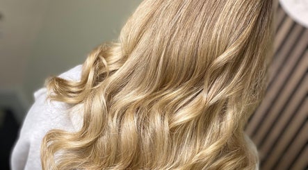 Blonde hair styled in soft waves at SC Hair Design, Thirsk, England, GB.
