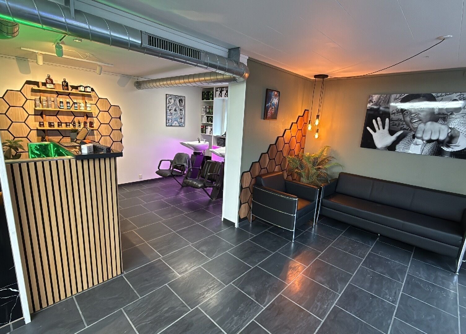 Stylish interior of B the barber at Tórshavn, Streymoyar, FO with modern seating and decor.