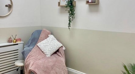 Serene treatment room at Lotus Skin, Beauty and Wellness, Mansfield, England, GB with plush decor and soothing colors.