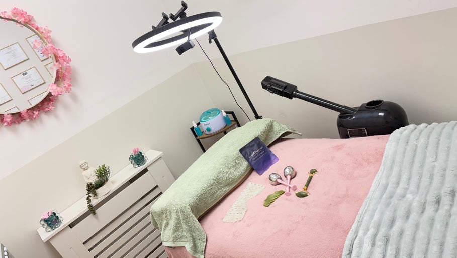 Relaxing spa room at Lotus Skin, Beauty and Wellness in Mansfield, England, GB, featuring a cozy treatment bed.