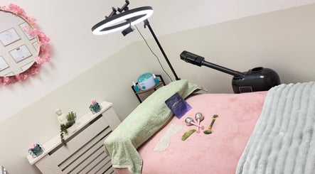Relaxing spa room at Lotus Skin, Beauty and Wellness in Mansfield, England, GB, featuring a cozy treatment bed.