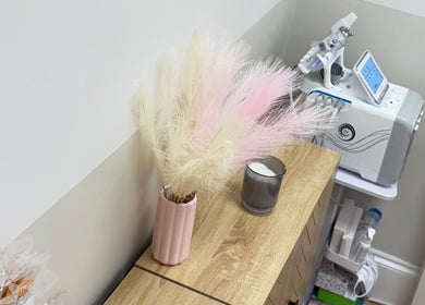 Calm treatment room at Lotus Skin, Beauty and Wellness in Mansfield, England, GB with floral decor and equipment.