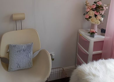 Cozy beauty corner at Lotus Skin, Beauty and Wellness, Mansfield, England, GB with soft decor and plush seating.