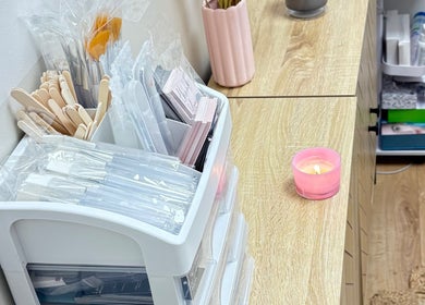 Beauty tools and candle at Lotus Skin, Beauty and Wellness, Mansfield, England, GB enhancing a serene atmosphere.
