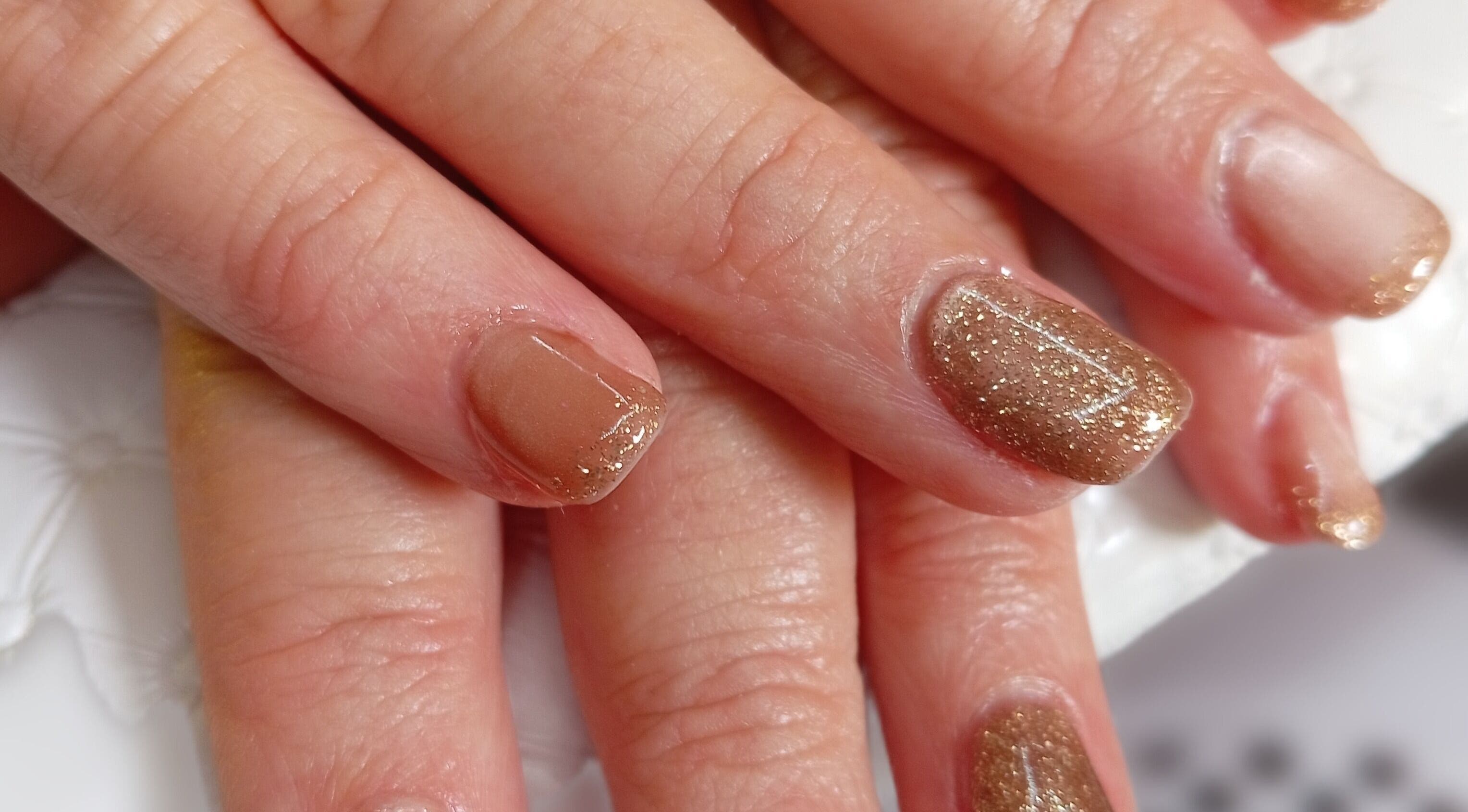 Gold glitter nails at Mari's Nail & Beauty Studio, Deneysville, Freestate, ZA showcase expert styling.