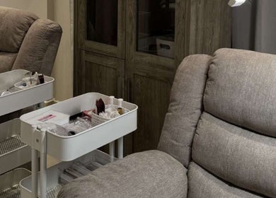 Comfortable seating and beauty equipment at SK Beauty studio, Abu Dhabi, AE.