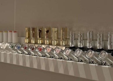 Elegant lipstick and nail polish display at SK Beauty Studio, Abu Dhabi, AE offering a chic selection.