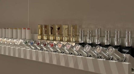Elegant lipstick and nail polish display at SK Beauty Studio, Abu Dhabi, AE offering a chic selection.