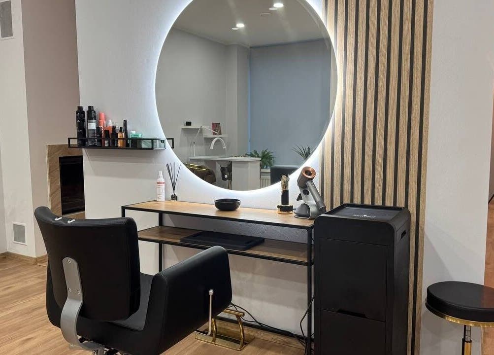 MSBeauty salon station with circular mirror and chair in Rīga, LV, showcasing modern beauty setup.