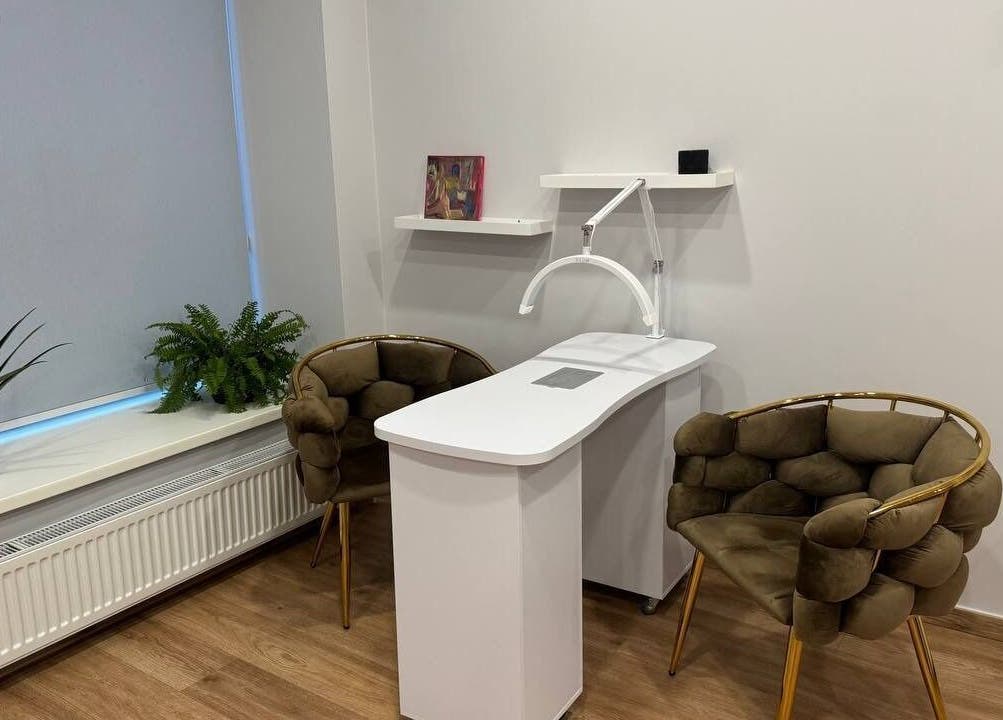 MSBeauty's elegant treatment area with plush chairs and plants in Rīga, LV.