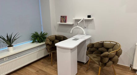 MSBeauty's elegant treatment area with plush chairs and plants in Rīga, LV.