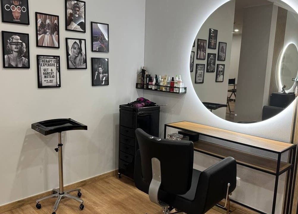 Stylish hairdressing station at MSBeauty, Rīga, LV, with modern decor and circular mirror.