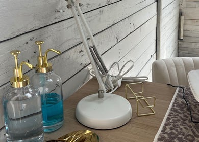 Stylish workstation at Glow Nails, Bournemouth, England, GB, showcasing elegant tools and products.