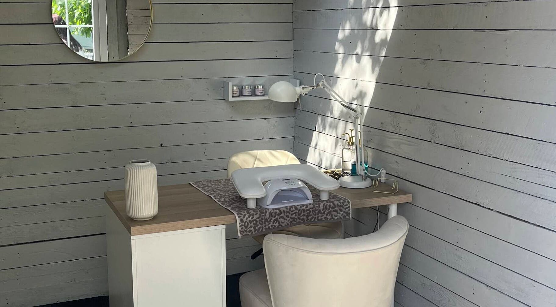 Elegant nail station at Glow Nails, Bournemouth, England, GB with chic decor and natural lighting.