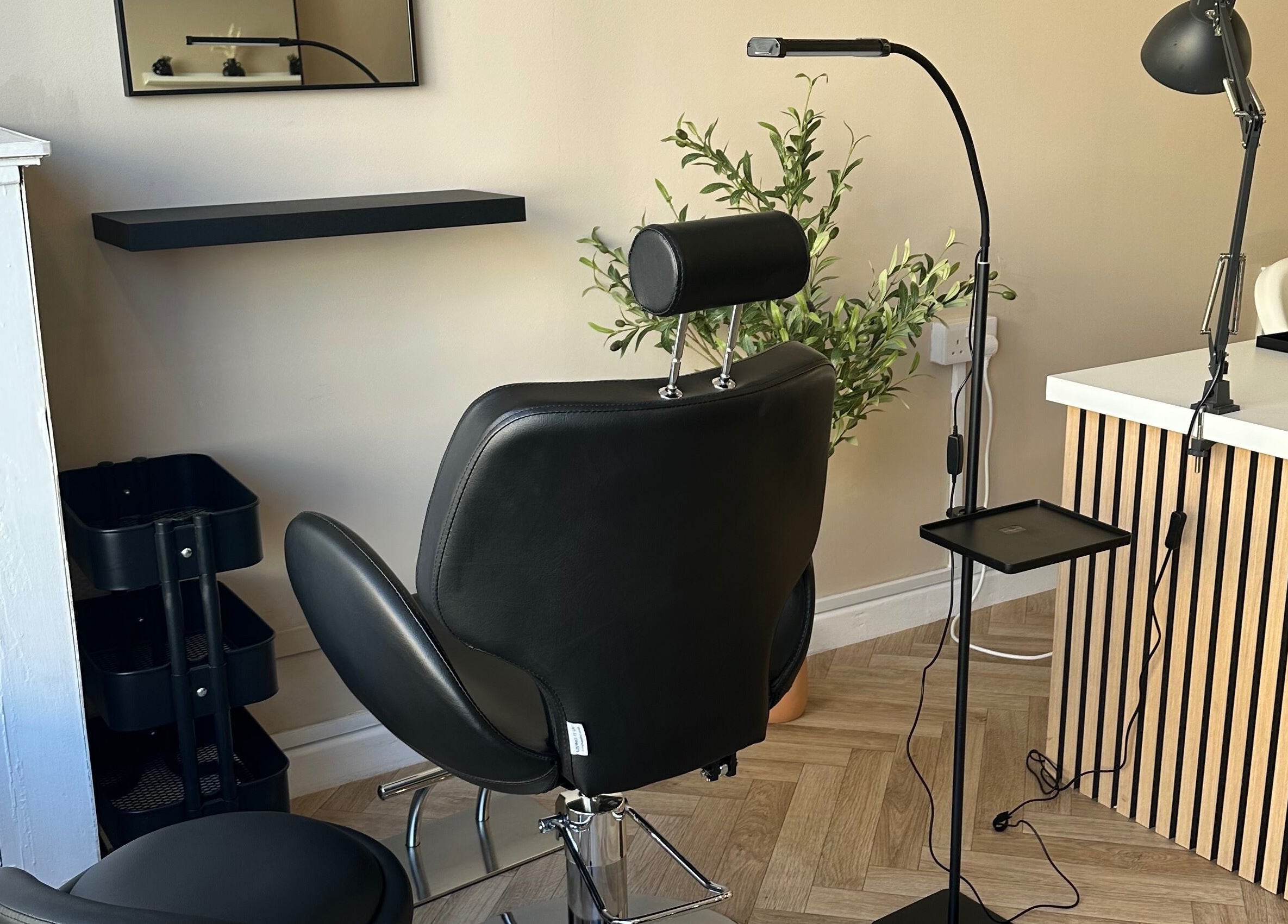 Modern styling chair at Coley’s Beauty, Preston, England, GB. Ideal for beauty treatments in a sleek setting.