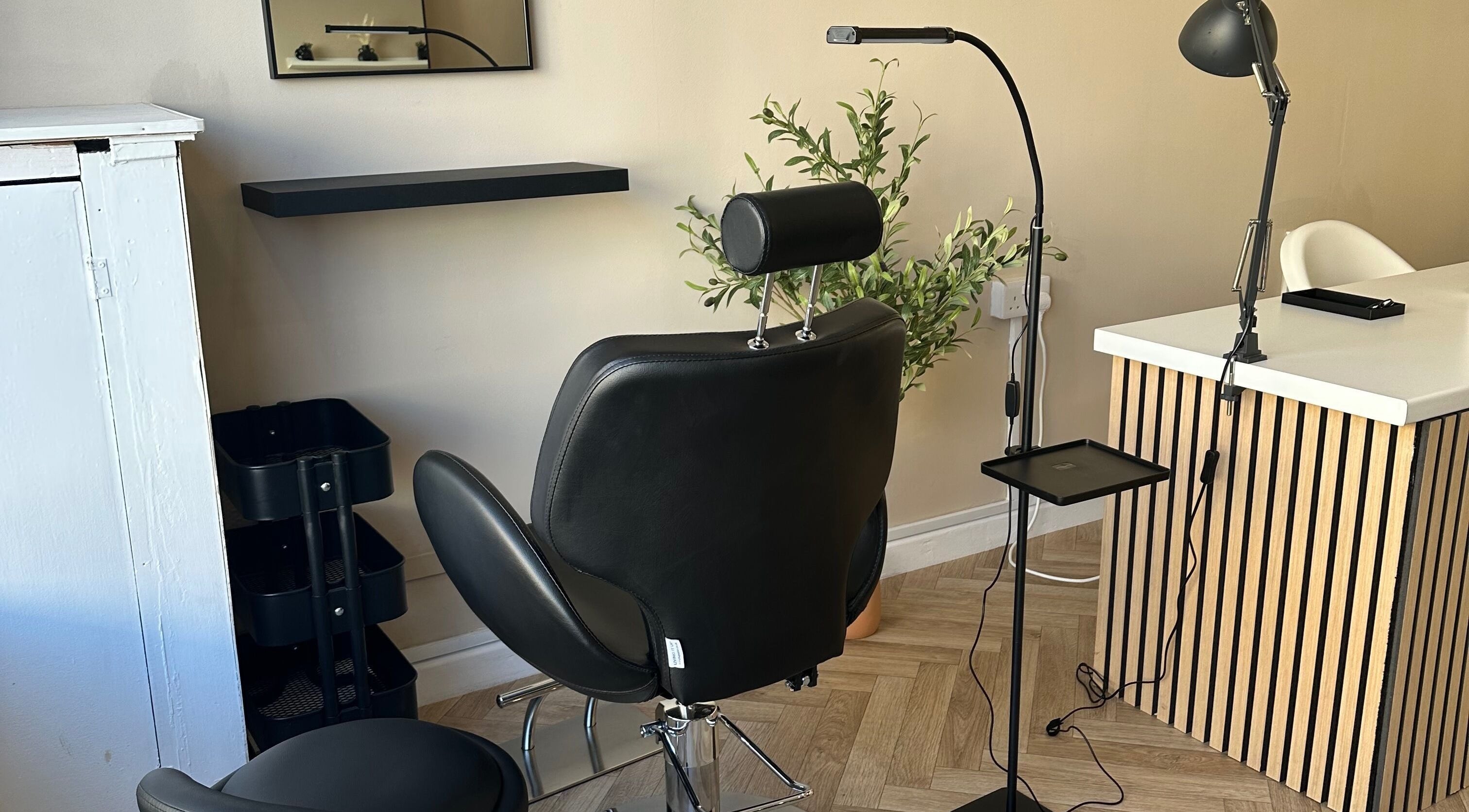 Modern styling chair at Coley’s Beauty, Preston, England, GB. Ideal for beauty treatments in a sleek setting.