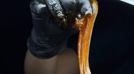 Sugaring paste in hand at Perle - Sugaring & Eye Beauty Treatments in Bali, Bali, ID, offers smooth beauty.