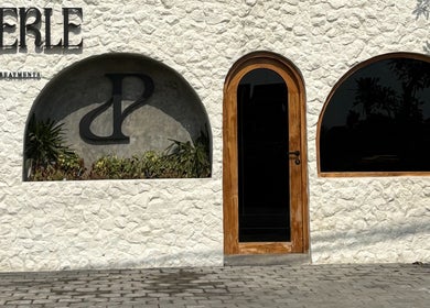 Entrance of Perle - Sugaring & Eye Beauty Treatments in Bali, Bali, ID, featuring stylish arched windows.