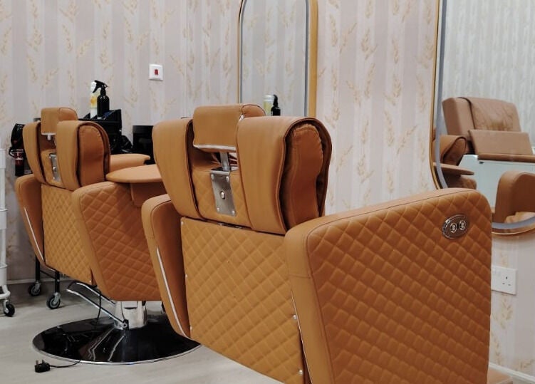 Elegant salon chairs at TMH SALON & SPA in Doha, Doha Municipality, QA, showcasing comfort and style.