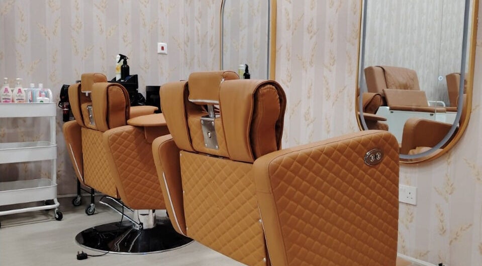 Elegant salon chairs at TMH SALON & SPA in Doha, Doha Municipality, QA, showcasing comfort and style.
