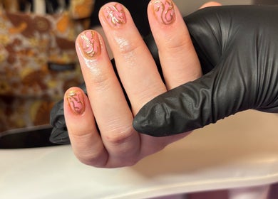 Intricate pink and gold nail art at Just Jess Nails in Cheltenham, England, GB showcasing expert nail care.