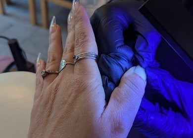Manicure in progress with UV light at Just Jess Nails, Cheltenham, England, GB.